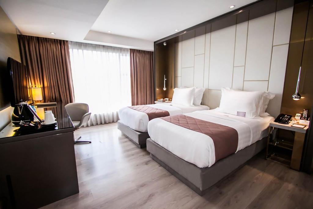 Postel nebo postele na pokoji v ubytování Hotel XYZ