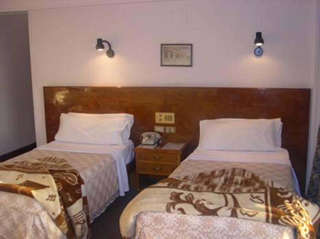 Postel nebo postele na pokoji v ubytování St.Joseph Hotel