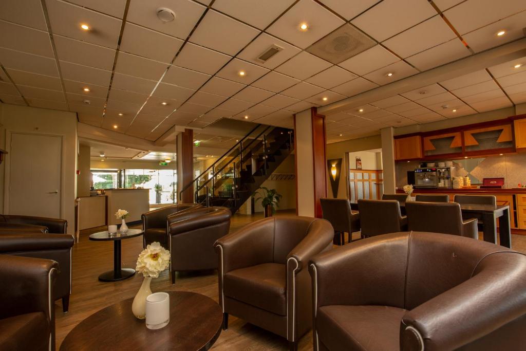 Posezení v ubytování Fletcher Hotel-Restaurant Paasberg
