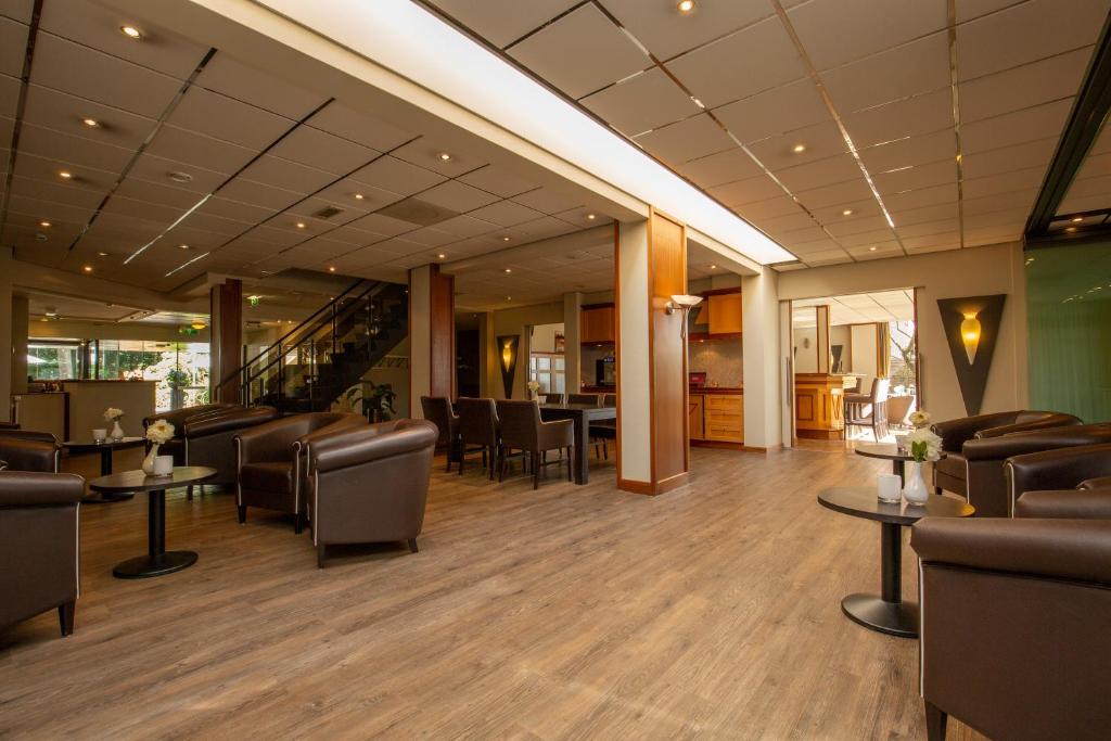 Posezení v ubytování Fletcher Hotel-Restaurant Paasberg