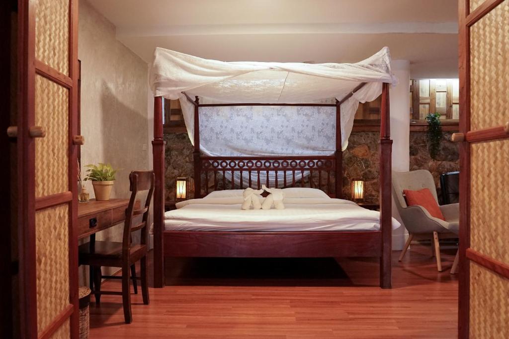 Postel nebo postele na pokoji v ubytování Koh Mak Cococape Resort