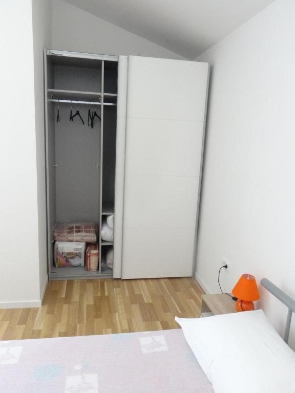 Postel nebo postele na pokoji v ubytování Apartmani Bura