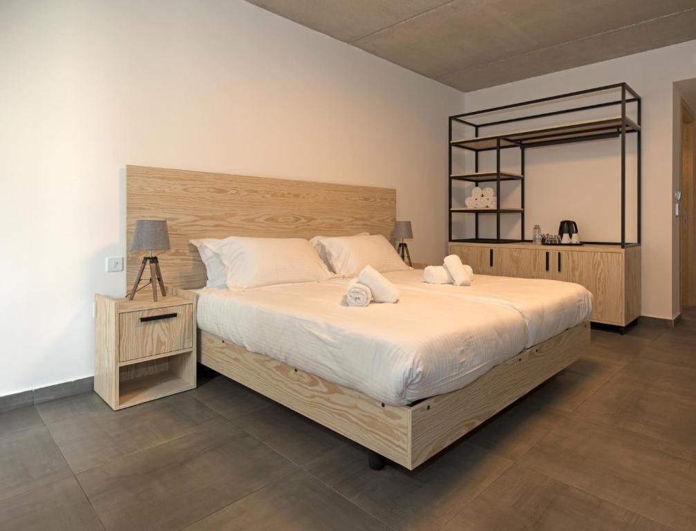 Postel nebo postele na pokoji v ubytování Mr Todd Hotel