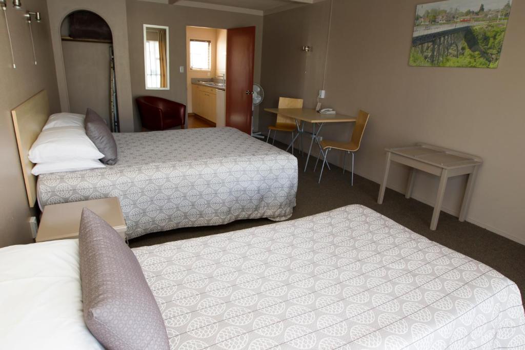 Postel nebo postele na pokoji v ubytování Aspen Manor Motel