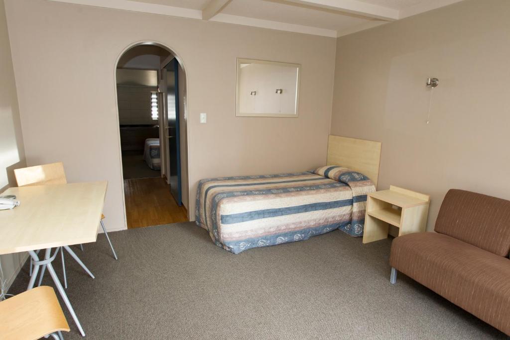 Postel nebo postele na pokoji v ubytování Aspen Manor Motel