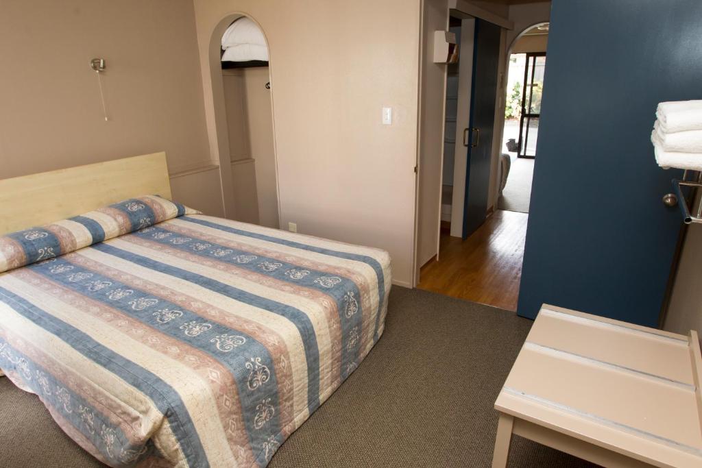 Postel nebo postele na pokoji v ubytování Aspen Manor Motel