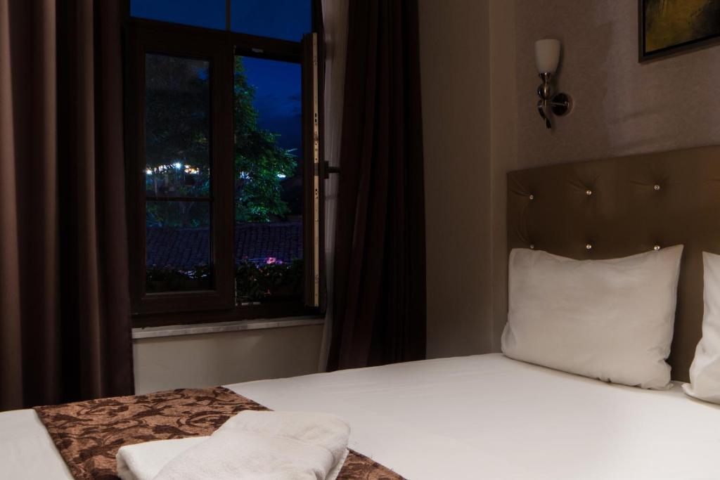 Postel nebo postele na pokoji v ubytování AEN Hotel-Old City