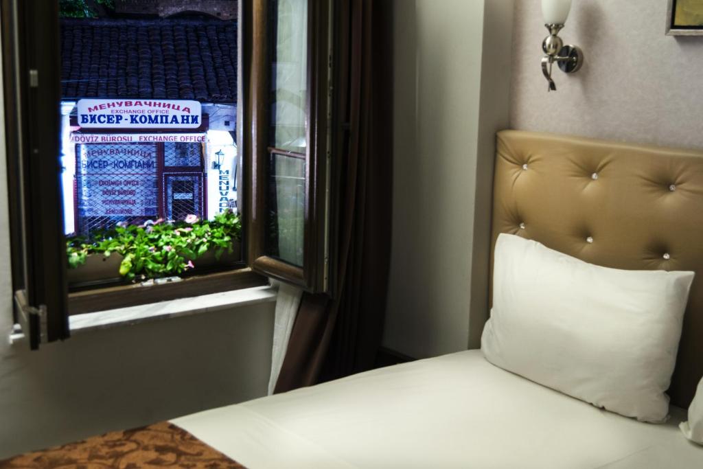 Postel nebo postele na pokoji v ubytování AEN Hotel-Old City