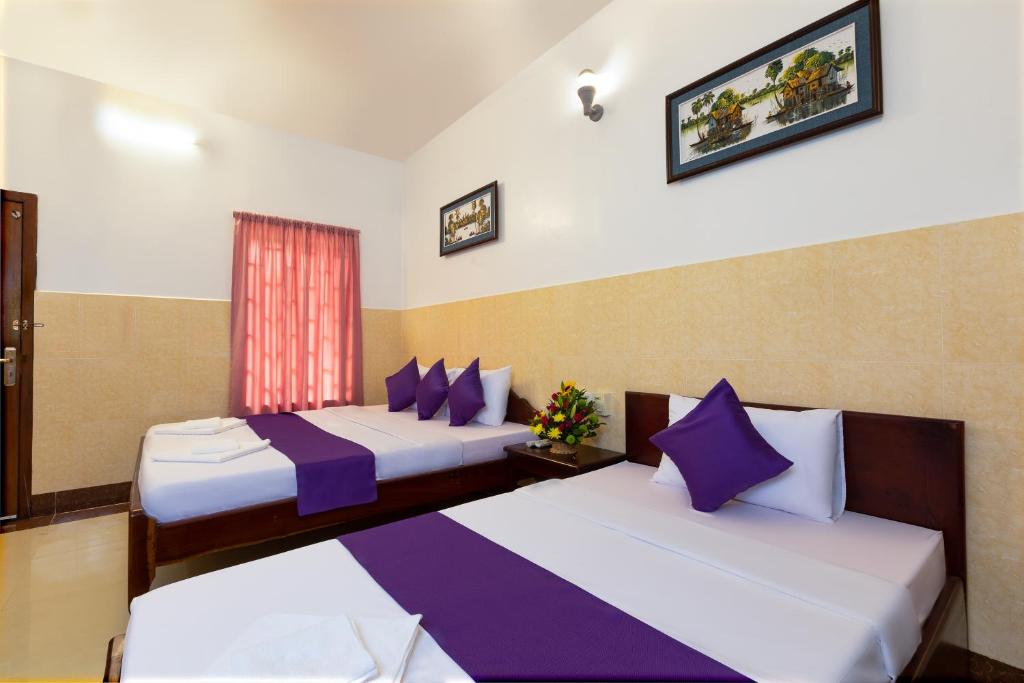 Ένα ή περισσότερα κρεβάτια σε δωμάτιο στο Botoum Hostel