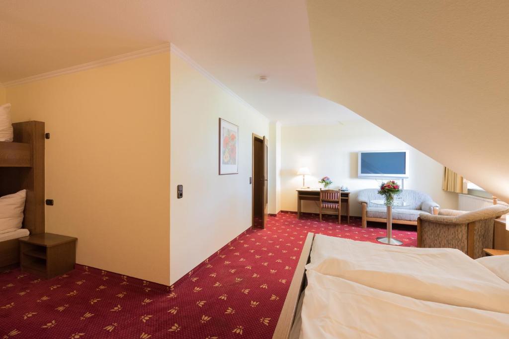 Postel nebo postele na pokoji v ubytování Hotel Röhrs