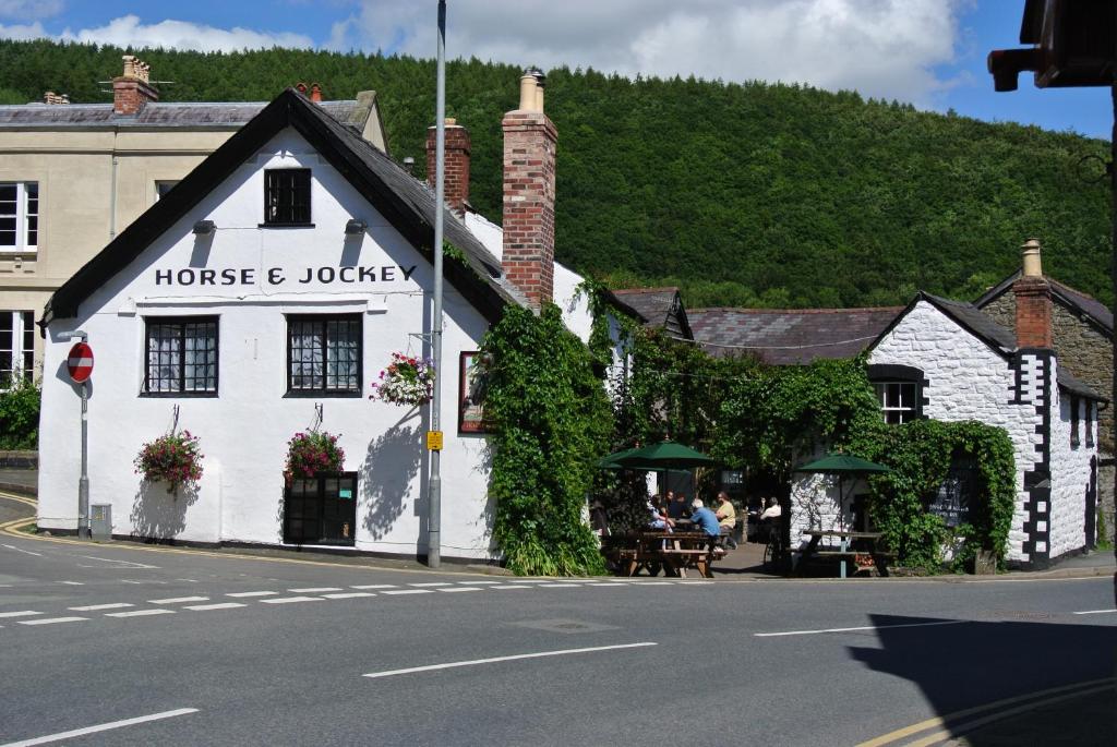 a white building on the side of a street at The Horse & Jockey Inn in Knighton
