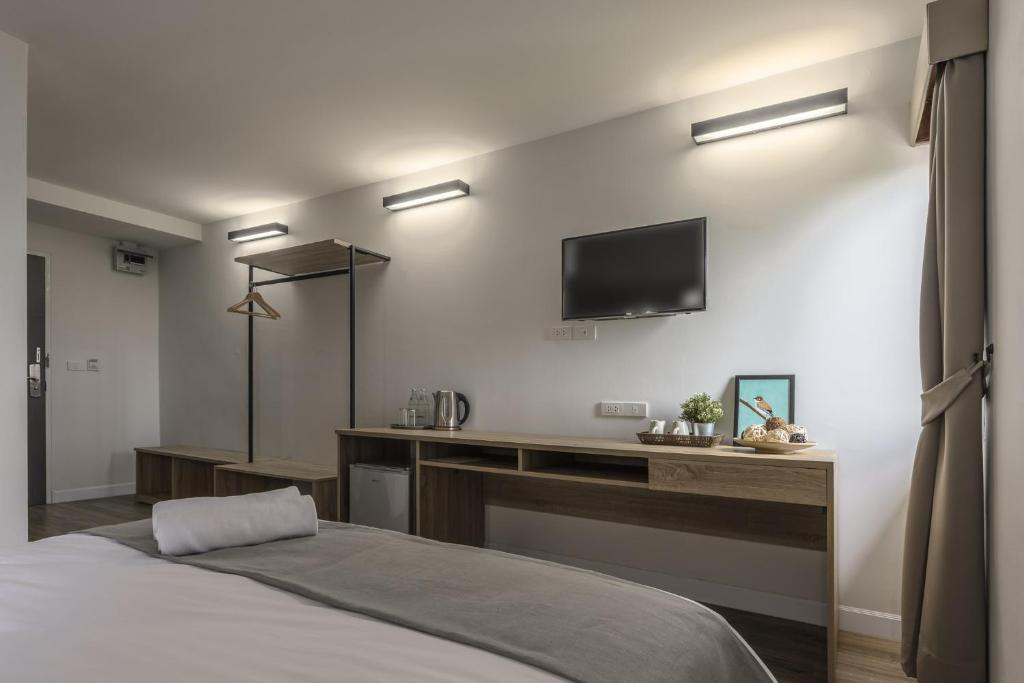 Postel nebo postele na pokoji v ubytování Carnation Residence