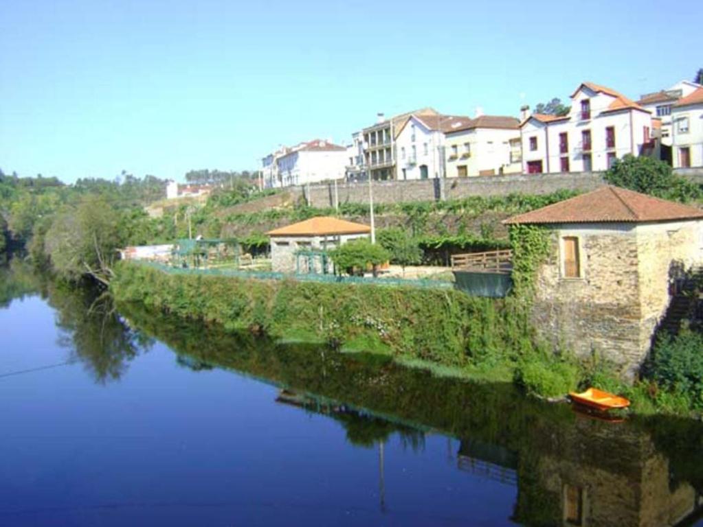 a river with houses on the side of it at Santa Clara in Coja