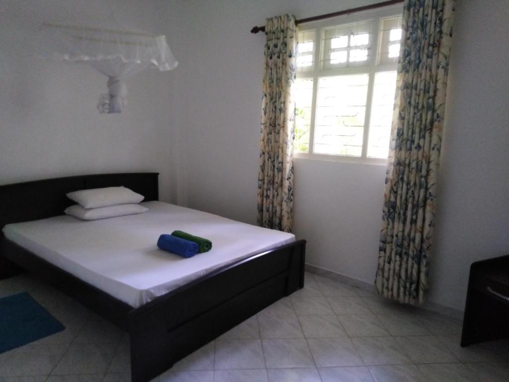 Postel nebo postele na pokoji v ubytování Anusha Apartment 15 Homestay