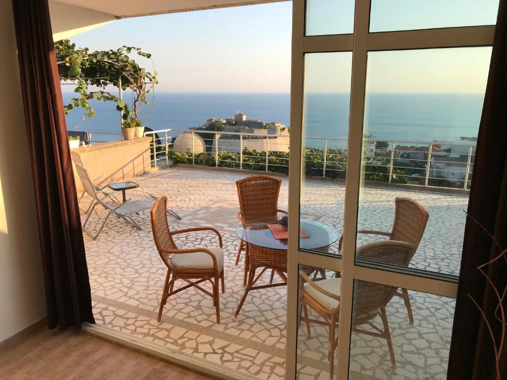 a view of a patio with chairs and a table at Apartment Jana in Ulcinj