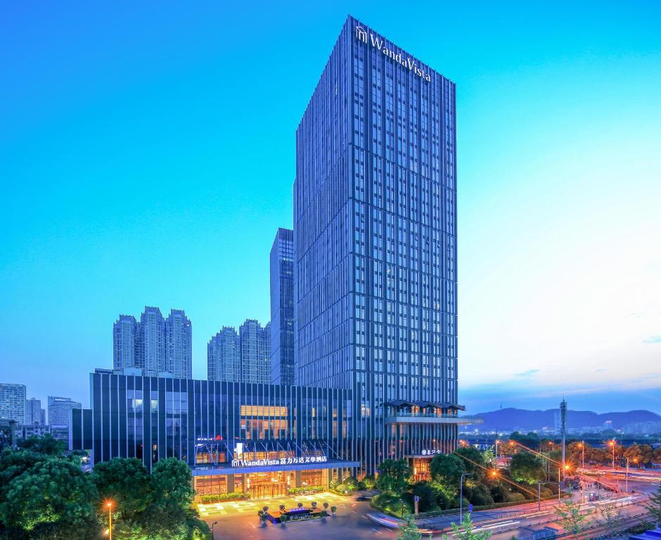 a rendering of a tall building in a city at Wanda Vista Changsha in Changsha