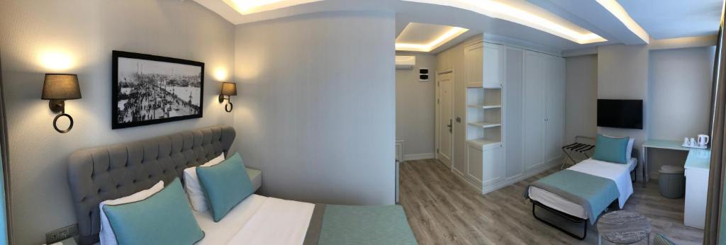 Postel nebo postele na pokoji v ubytování Centrum Suites İstanbul