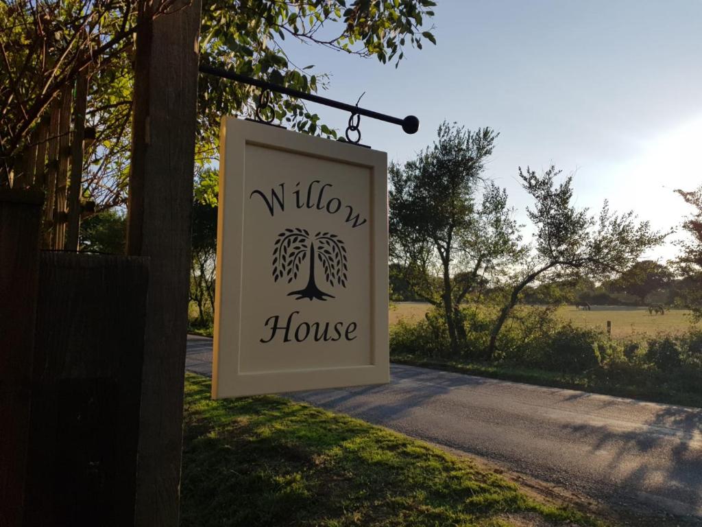 a sign for a wilson house on a driveway at Willow House B&B in West Wittering
