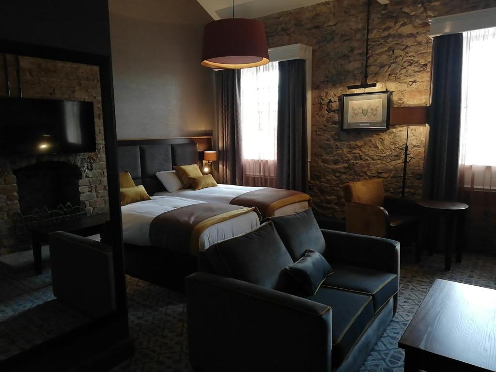 Ένα ή περισσότερα κρεβάτια σε δωμάτιο στο The Old Borough Hotel - Wetherspoon