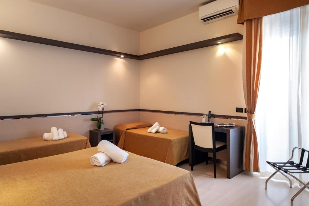 Кровать или кровати в номере Hotel Mondial