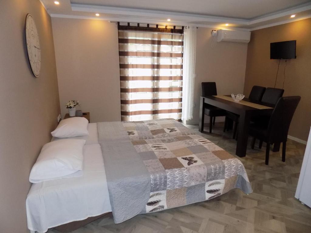 Postel nebo postele na pokoji v ubytování Apartman Bogić