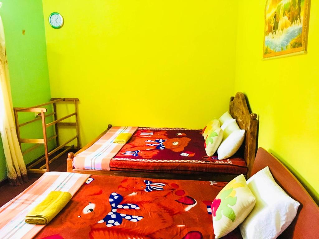 Postel nebo postele na pokoji v ubytování Sudu Neluma Home Stay