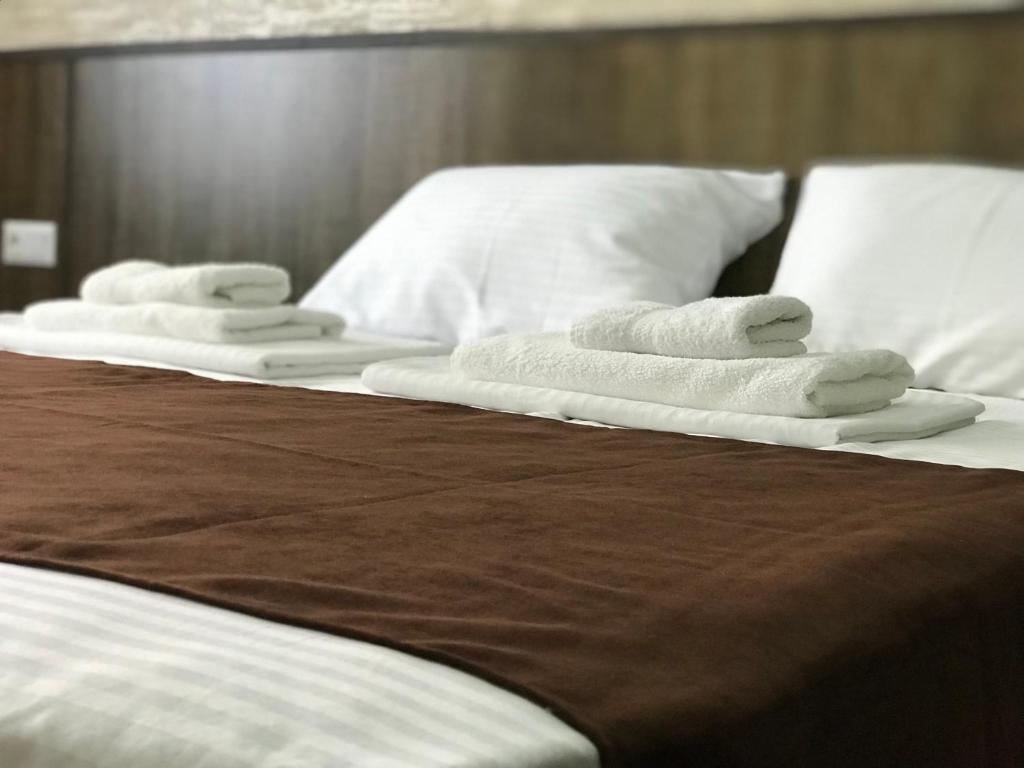 Postel nebo postele na pokoji v ubytování Hobby Hotel