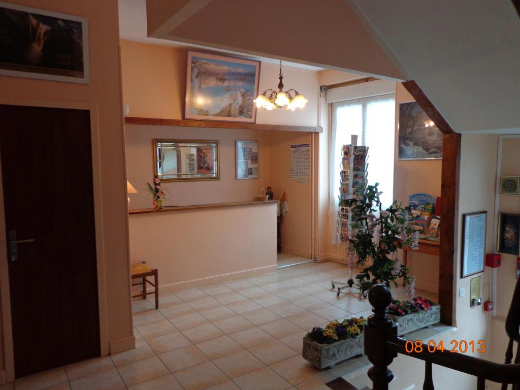 Kuchyň nebo kuchyňský kout v ubytování Hôtel Hélios