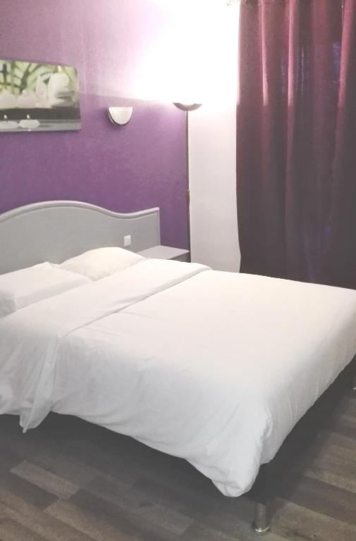 Postel nebo postele na pokoji v ubytování Le Neoulous