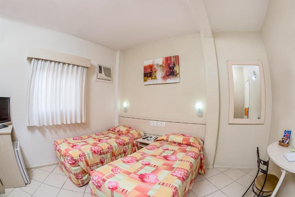 Postel nebo postele na pokoji v ubytování Hotel Express Canoas