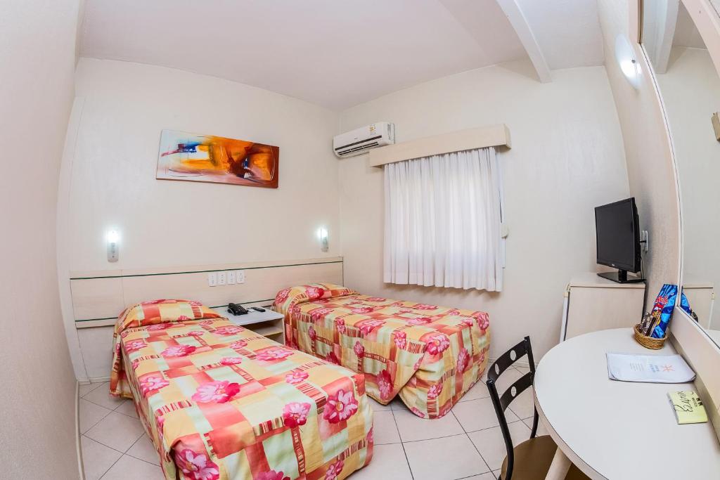 Postel nebo postele na pokoji v ubytování Hotel Express Canoas