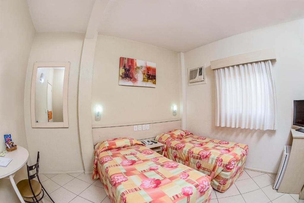 Postel nebo postele na pokoji v ubytování Hotel Express Canoas