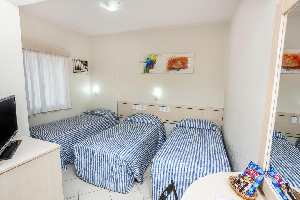 Postel nebo postele na pokoji v ubytování Hotel Express Canoas