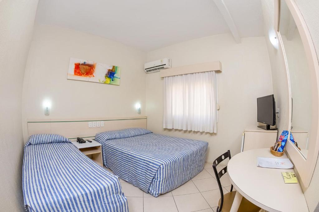 Postel nebo postele na pokoji v ubytování Hotel Express Canoas