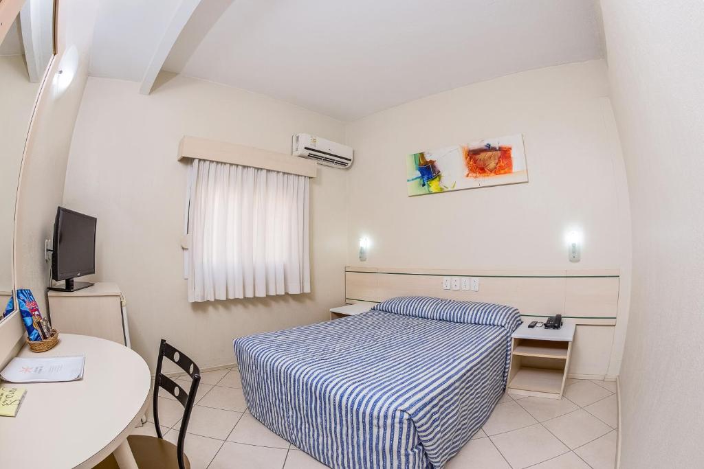 Postel nebo postele na pokoji v ubytování Hotel Express Canoas