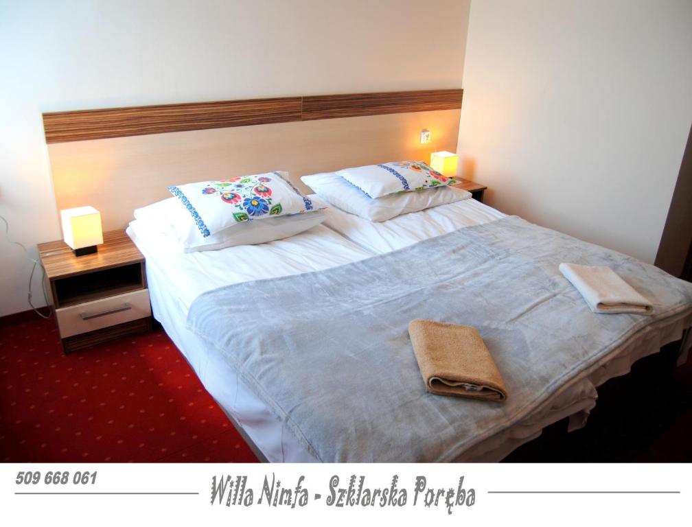 Posteľ alebo postele v izbe v ubytovaní Willa Nimfa pokoje i apartamenty, również cała willa na wyłączność