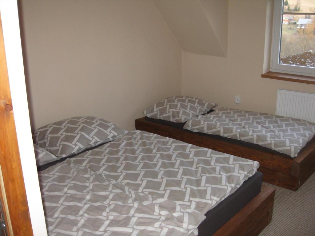 Postel nebo postele na pokoji v ubytování Apartmány U Vlka