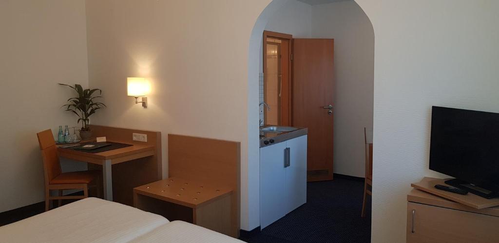 TV a/nebo společenská místnost v ubytování Hotel Beuss