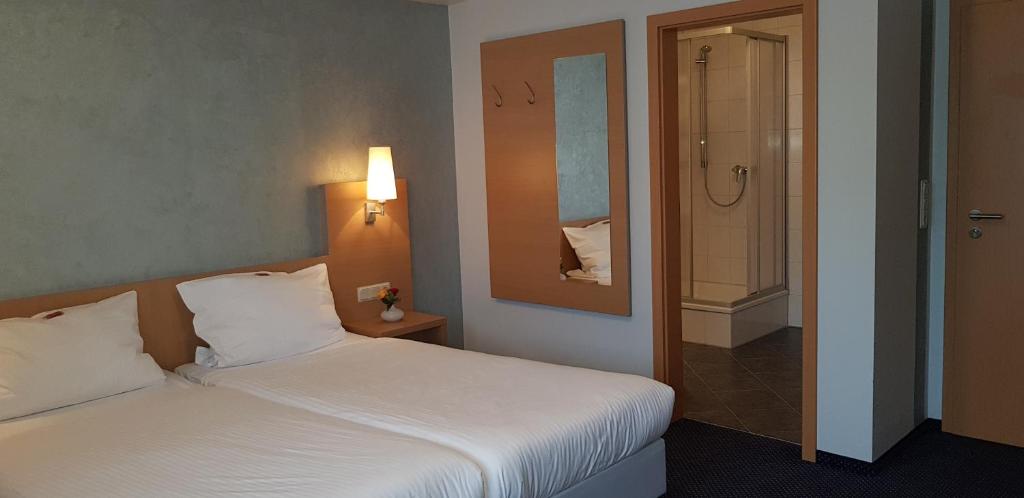 Postel nebo postele na pokoji v ubytování Hotel Beuss