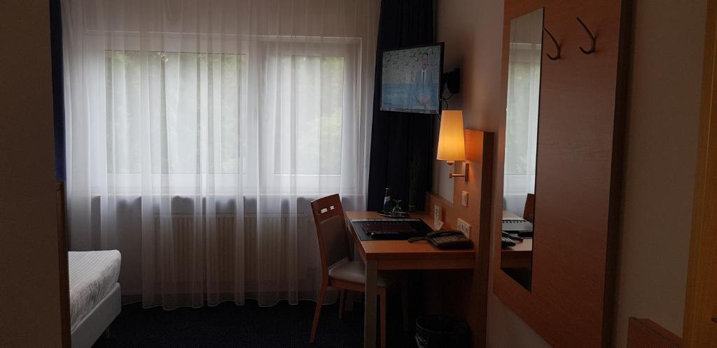 TV a/nebo společenská místnost v ubytování Hotel Beuss