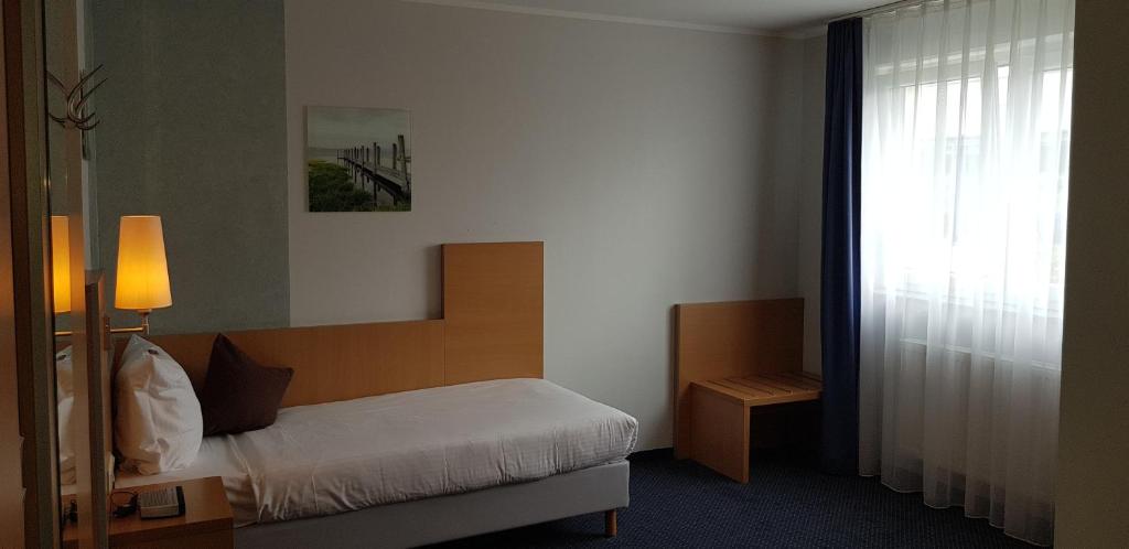 Postel nebo postele na pokoji v ubytování Hotel Beuss