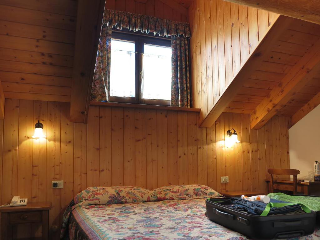 Postel nebo postele na pokoji v ubytování Hotel Locanda Grauson