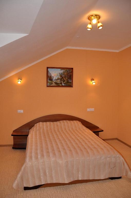 Postel nebo postele na pokoji v ubytování Focus Hotel