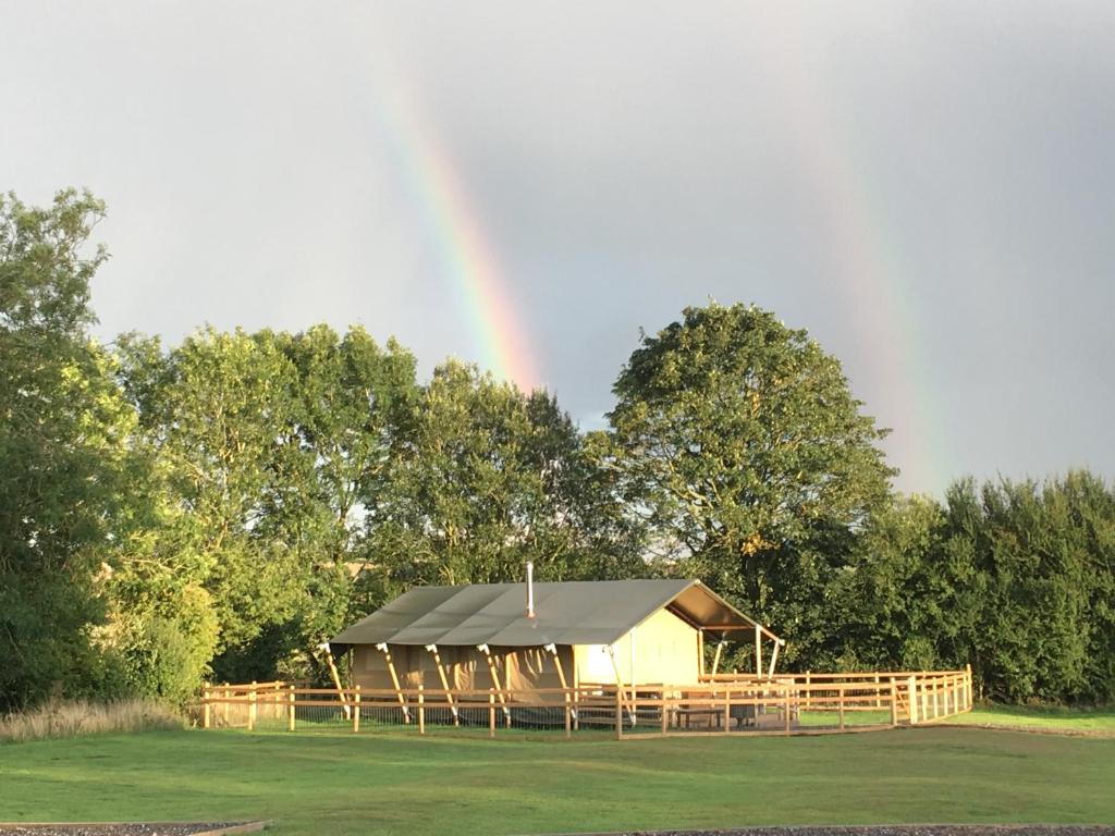 a rainbow over a gazebo with a tent at Lincolnshire Glamping in Horncastle