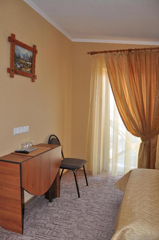 Postel nebo postele na pokoji v ubytování Focus Hotel