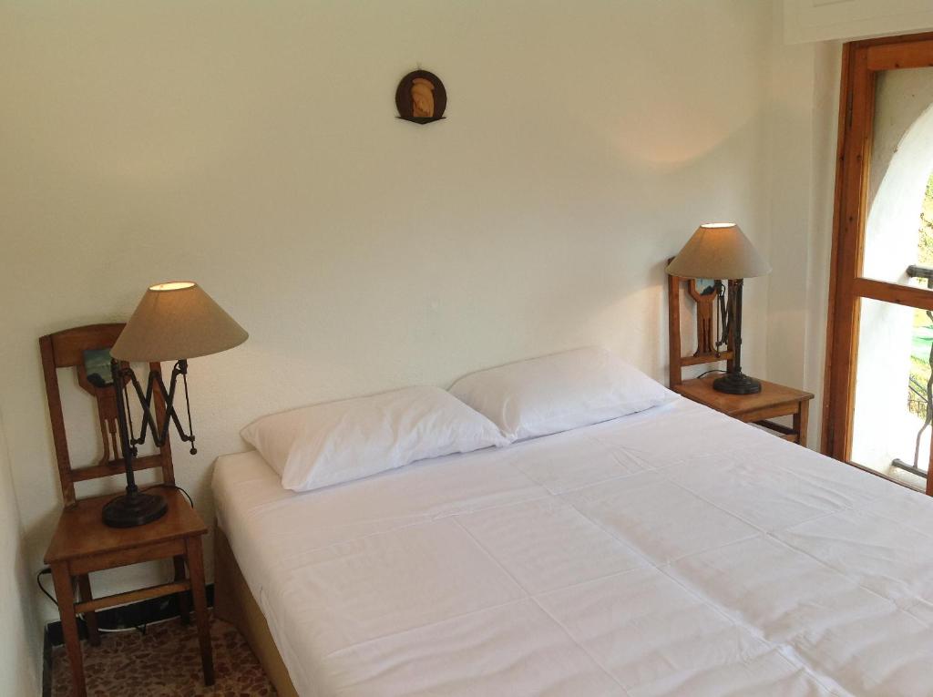 Postel nebo postele na pokoji v ubytování Villa Cadenza