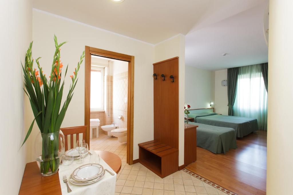 Postel nebo postele na pokoji v ubytování Astor Hotel Vintage