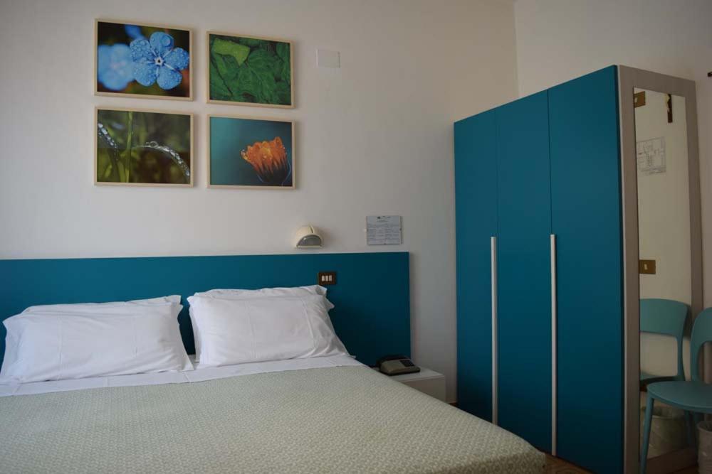 Postel nebo postele na pokoji v ubytování Eco-Hotel Edy