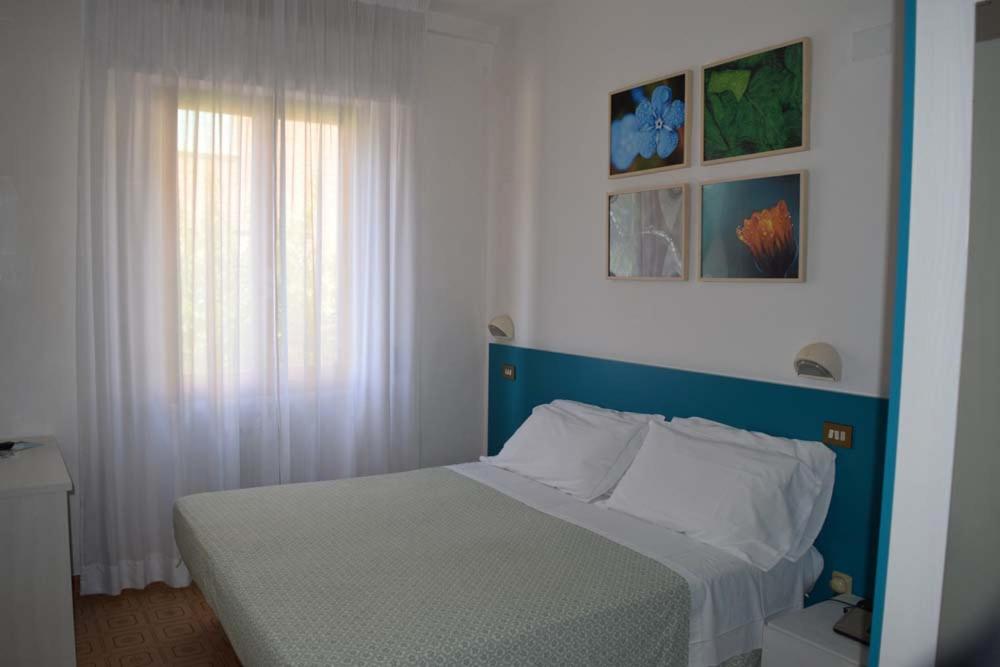 Postel nebo postele na pokoji v ubytování Eco-Hotel Edy