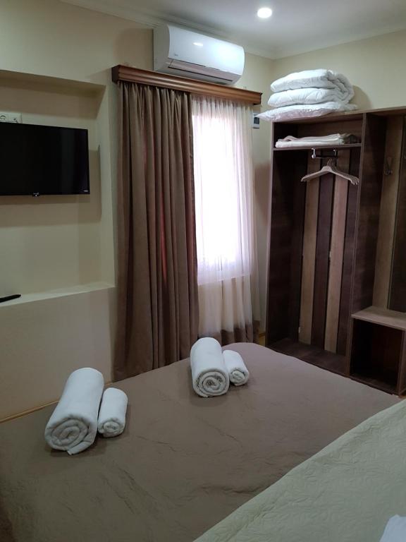Postel nebo postele na pokoji v ubytování Hotel Villa